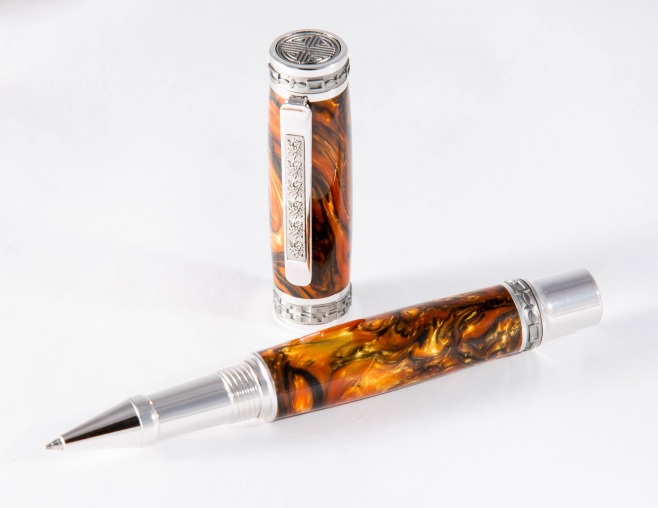 The Emperor Pen with Tigers Eye acrylic, titanium and rhodium parts and rollerball fill.